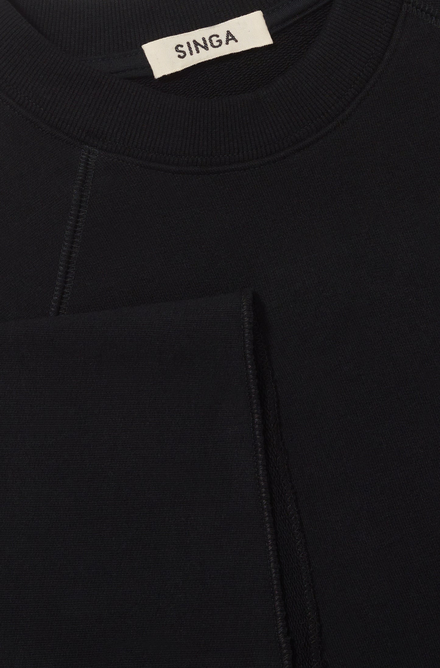 OVER RAGLAN PUNHOS - PRETO